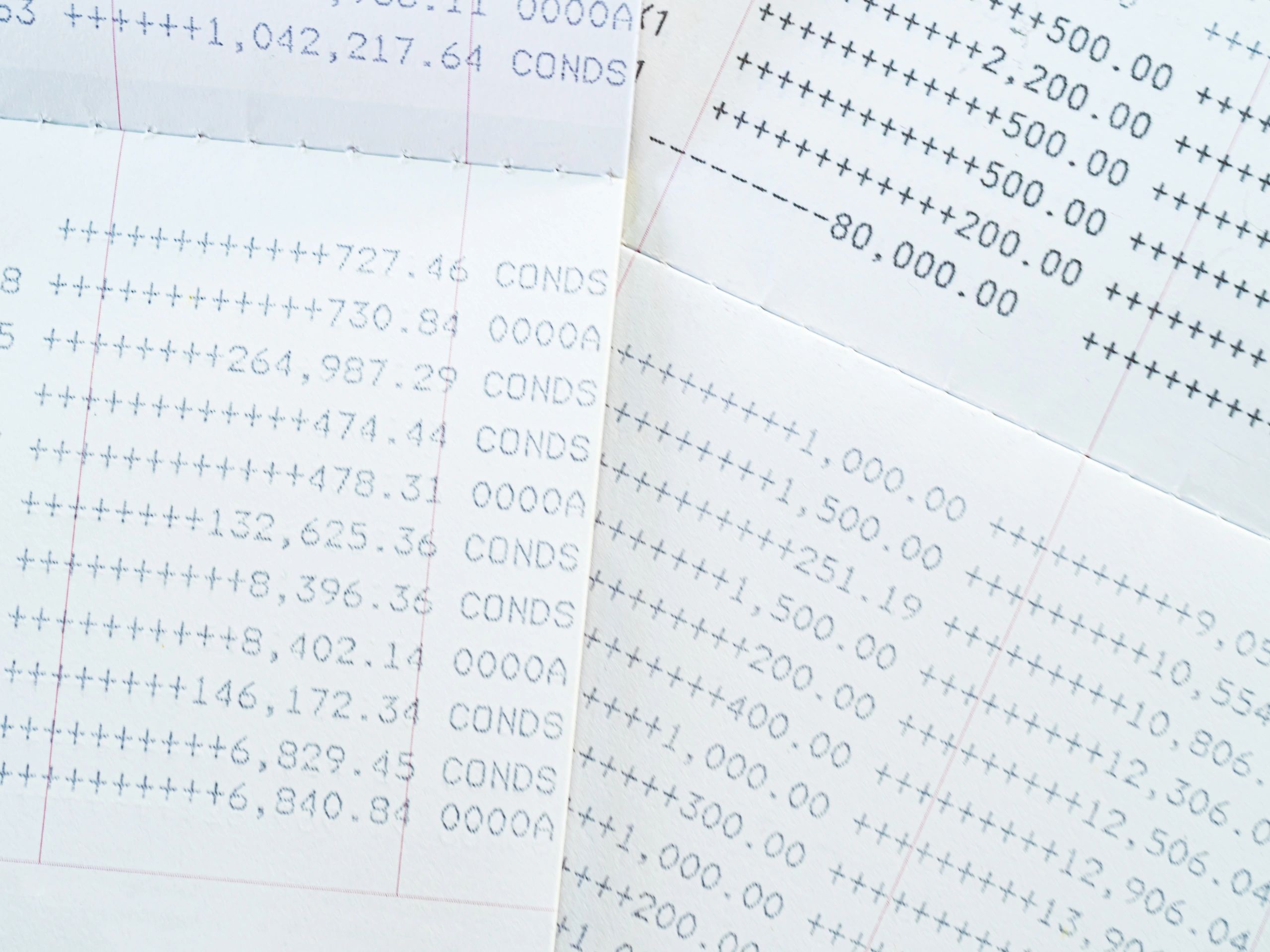 Bank reconciliation paperwork with calculator and pen